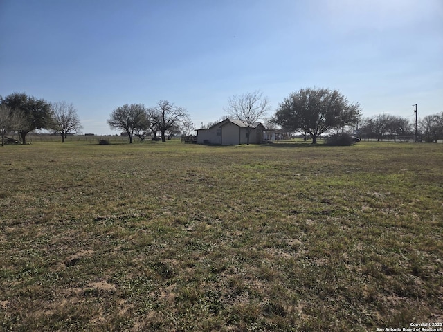 view of yard with a rural view