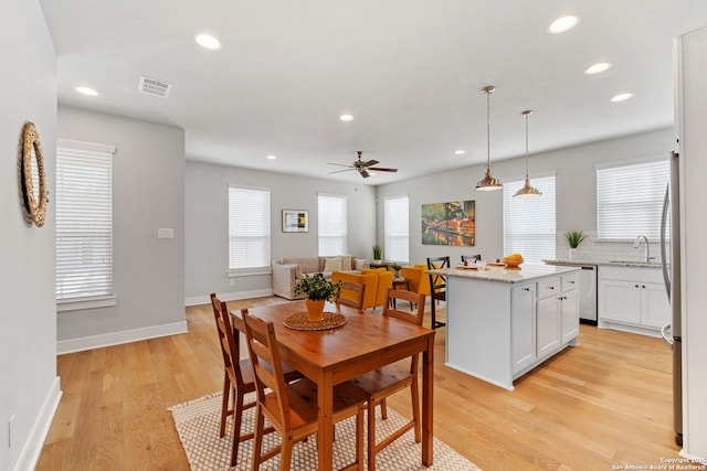 dining room with visible vents, recessed lighting, light wood-type flooring, and baseboards