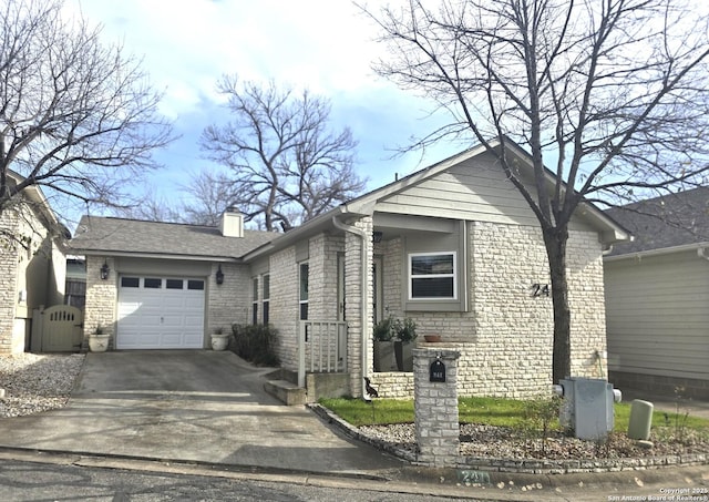 view of front of house with roof with shingles, concrete driveway, an attached garage, brick siding, and a chimney