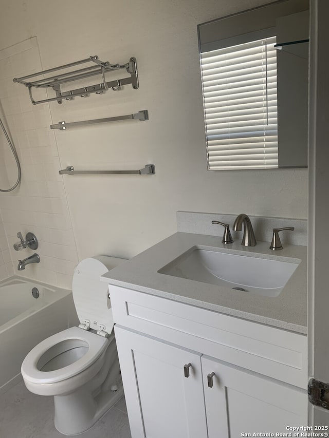 bathroom with shower / bathing tub combination, toilet, and vanity