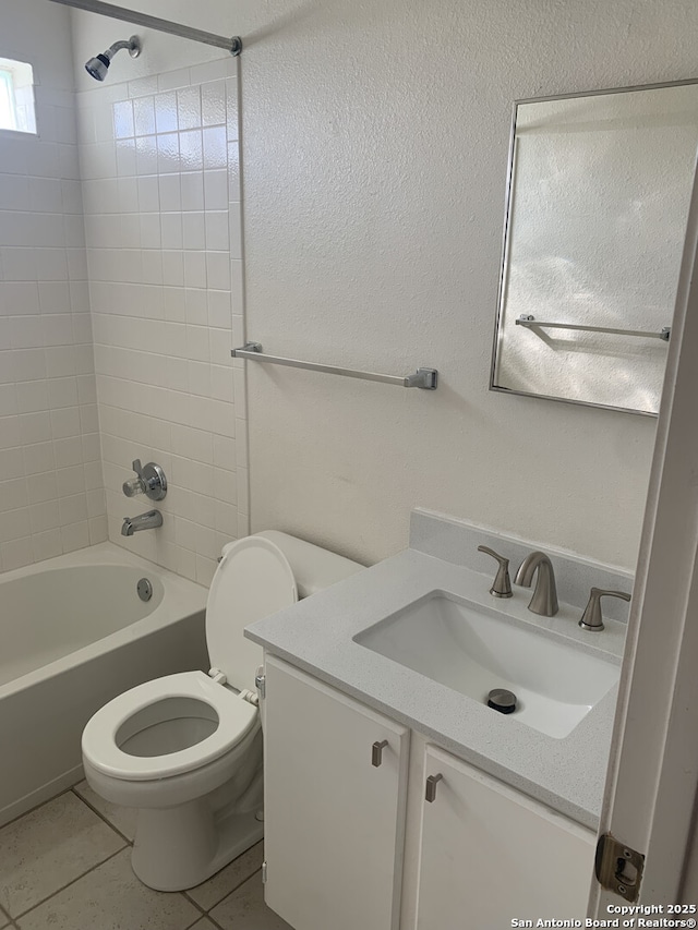 full bath featuring bathtub / shower combination, tile patterned floors, toilet, and vanity