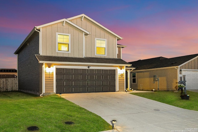 view of front of property featuring fence, driveway, a garage, a lawn, and board and batten siding