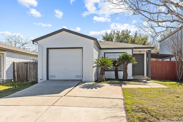 ranch-style house with a front lawn, brick siding, driveway, and fence