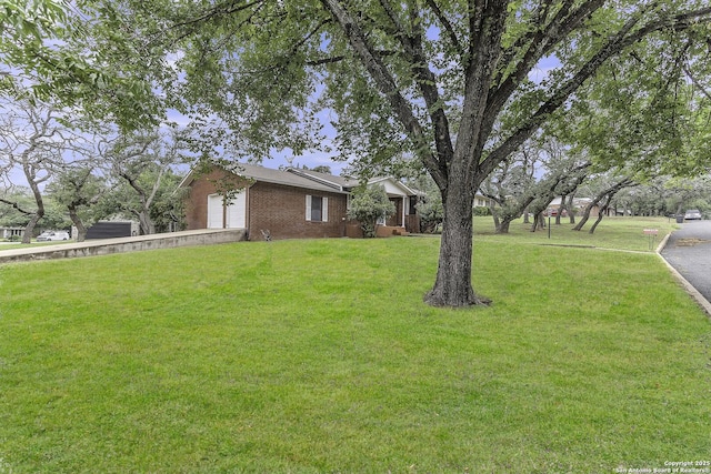 view of yard with a garage