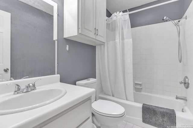 bathroom featuring vanity, toilet, shower / bath combo, and tile patterned flooring