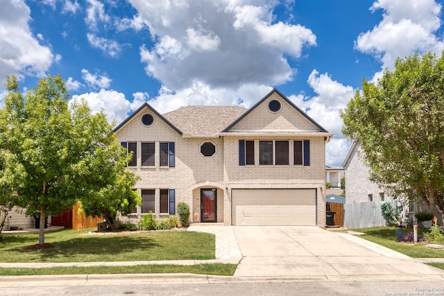 view of front of property featuring fence, concrete driveway, a front lawn, a garage, and brick siding