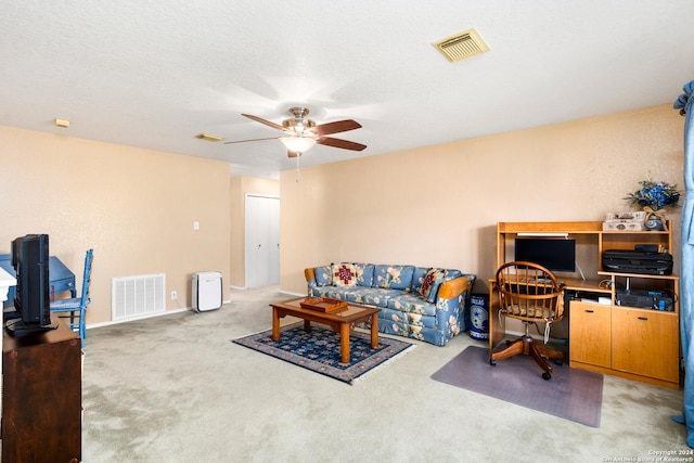 interior space featuring visible vents, a textured ceiling, and a ceiling fan