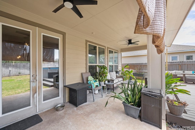 view of patio with a ceiling fan and fence