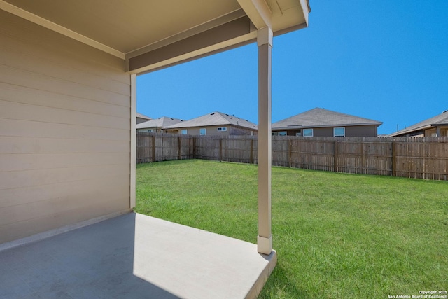 view of yard with a fenced backyard and a patio