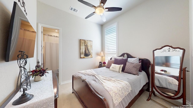 bedroom featuring visible vents, baseboards, light colored carpet, and ceiling fan