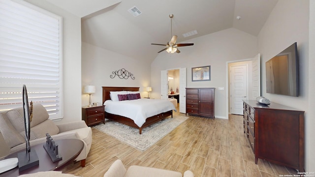 bedroom with light wood-style flooring, visible vents, high vaulted ceiling, and ceiling fan