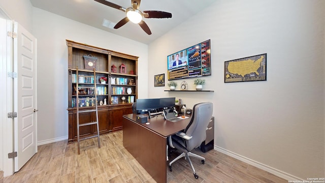 office featuring baseboards, a ceiling fan, and wood tiled floor