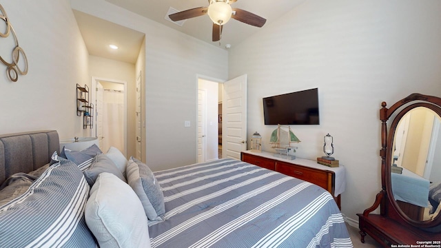 bedroom with lofted ceiling and a ceiling fan