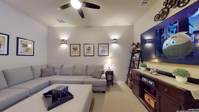 living room featuring ceiling fan, baseboards, visible vents, and light carpet