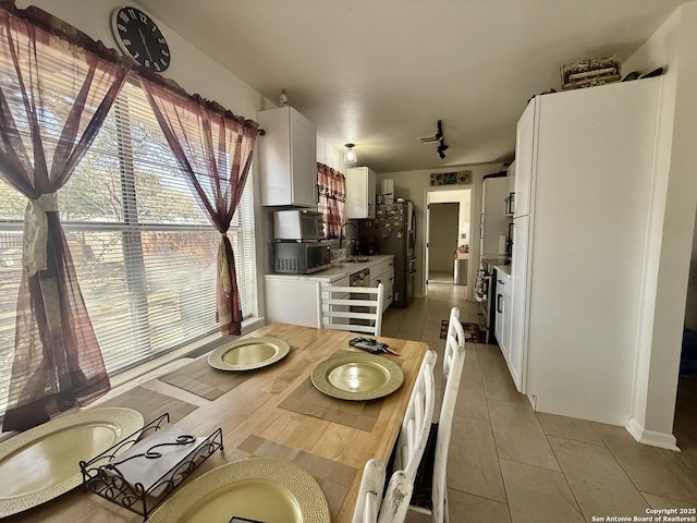 dining room featuring light tile patterned flooring