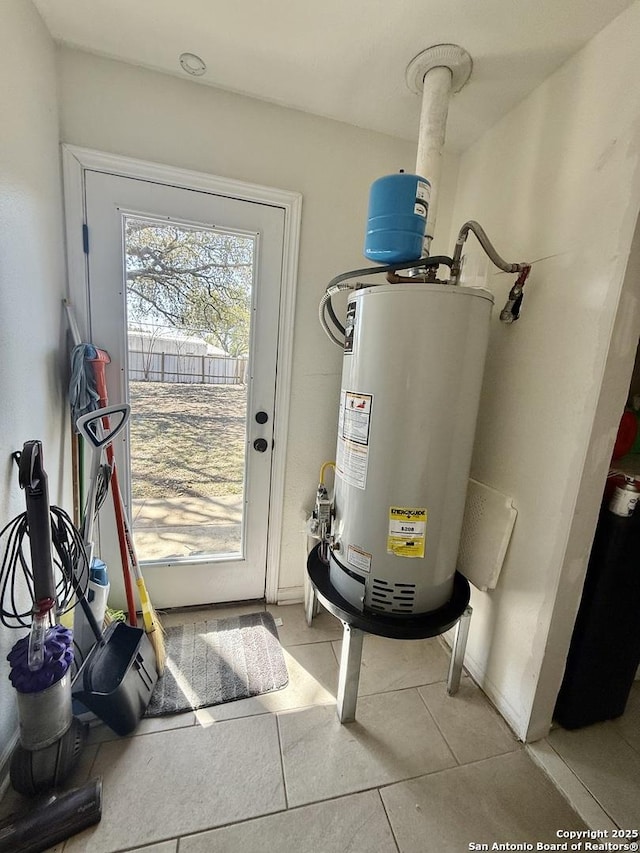 utility room featuring gas water heater