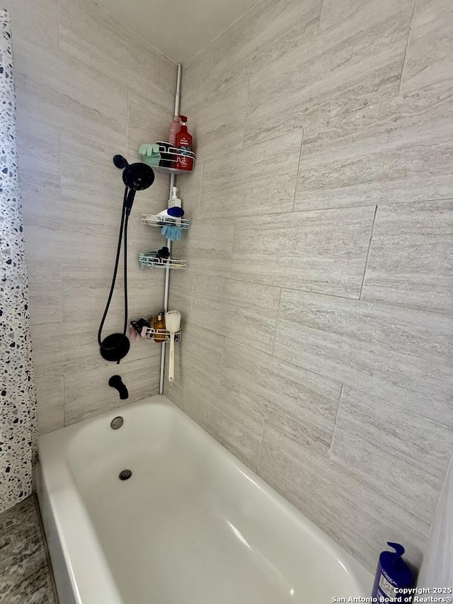 bathroom with shower / washtub combination