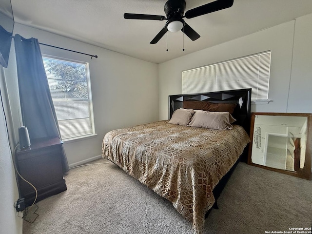 carpeted bedroom with a ceiling fan