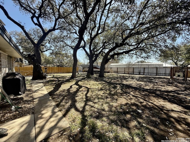 view of yard with a fenced backyard