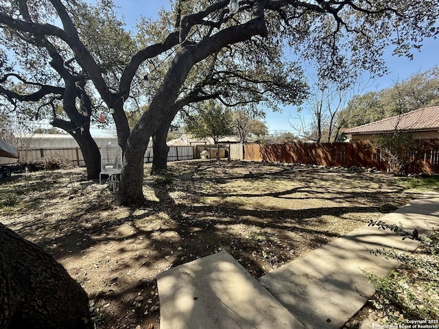 view of yard with a fenced backyard