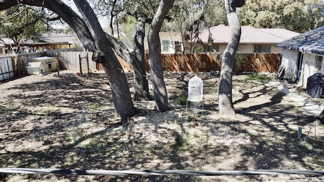 view of yard with a fenced backyard