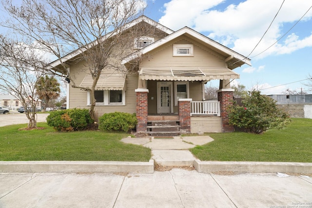 view of front of property with a porch and a front yard