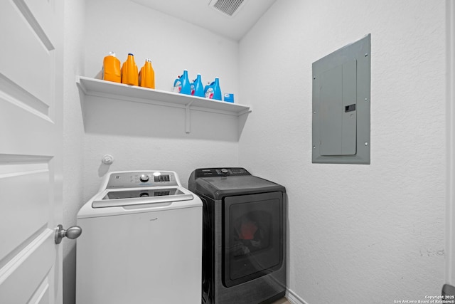 10619 Revolver Trl, San Antonio, TX 78254 - washroom featuring electric panel, visible vents, separate washer and dryer, and laundry area