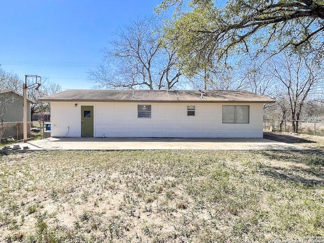 back of house with a patio area, a lawn, and fence