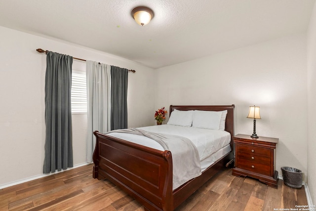 bedroom featuring wood finished floors