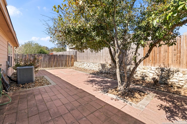 view of patio / terrace featuring central AC unit and a fenced backyard