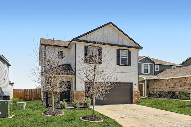 traditional-style house with fence, driveway, a garage, board and batten siding, and brick siding