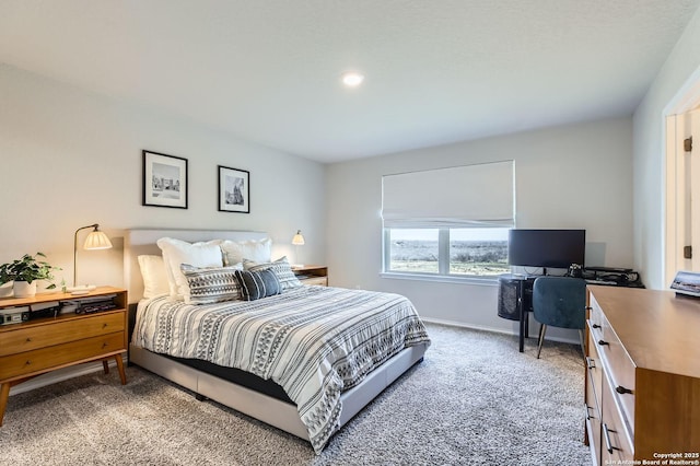 bedroom featuring baseboards and carpet floors