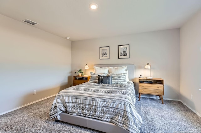 carpeted bedroom featuring visible vents and baseboards