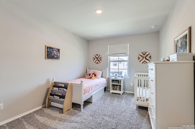 carpeted bedroom with baseboards