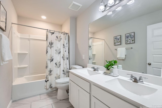 bathroom featuring toilet, shower / bath combo, visible vents, and a sink