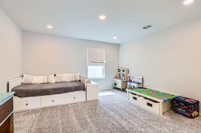 carpeted bedroom featuring recessed lighting and visible vents