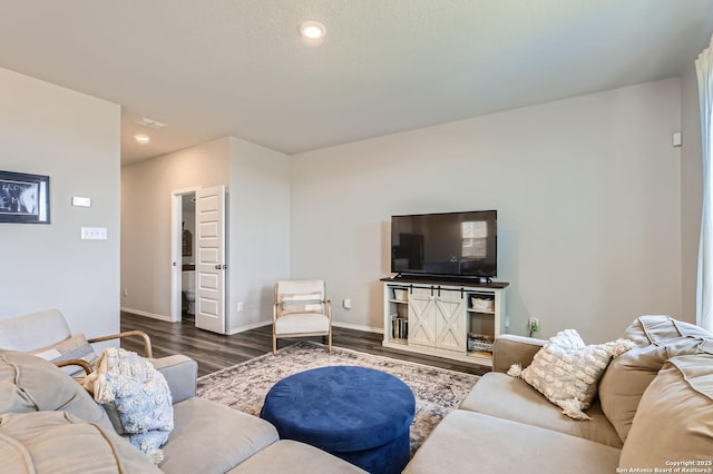 living room with dark wood finished floors, recessed lighting, and baseboards