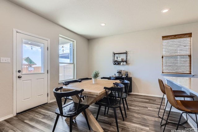 dining room featuring dark wood-style floors, recessed lighting, and baseboards