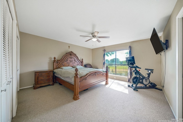 bedroom featuring a ceiling fan, baseboards, and carpet floors