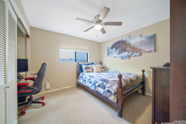 carpeted bedroom featuring a ceiling fan and baseboards