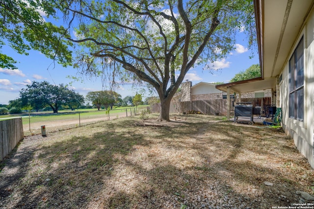 view of yard with a fenced backyard