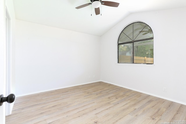 unfurnished room featuring a ceiling fan, lofted ceiling, wood finished floors, and baseboards