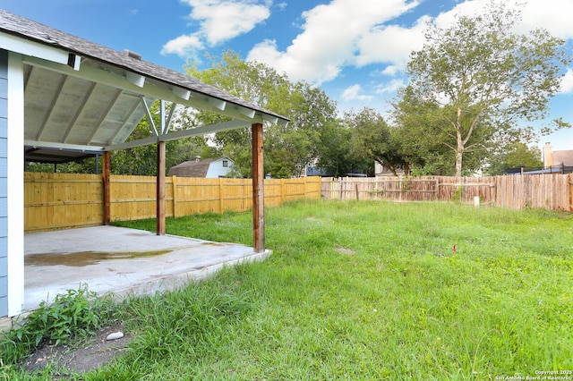 view of yard featuring a patio and fence