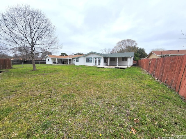 view of yard featuring a fenced backyard and a wooden deck