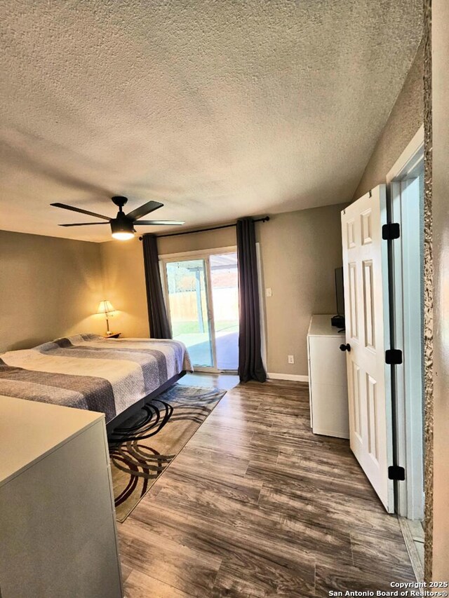 bedroom with wood finished floors, baseboards, ceiling fan, access to exterior, and a textured ceiling