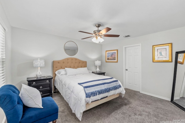 carpeted bedroom featuring visible vents, a ceiling fan, and baseboards