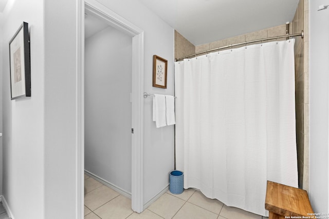 full bath with tile patterned flooring and curtained shower