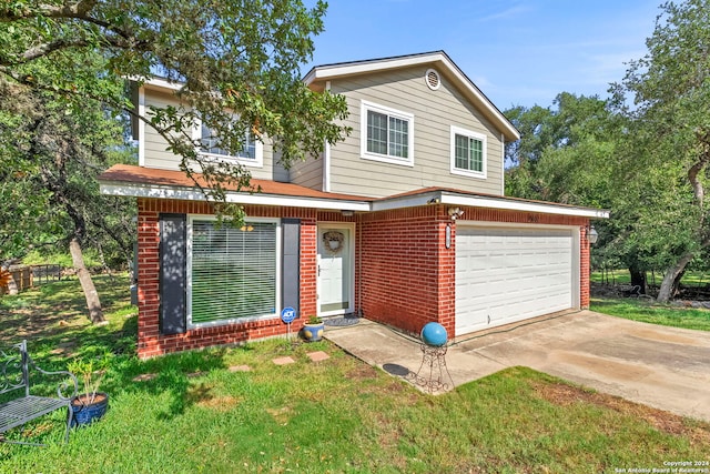 traditional-style house featuring brick siding, concrete driveway, a garage, and a front yard