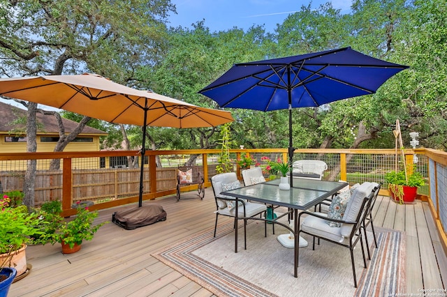 wooden deck featuring outdoor dining space