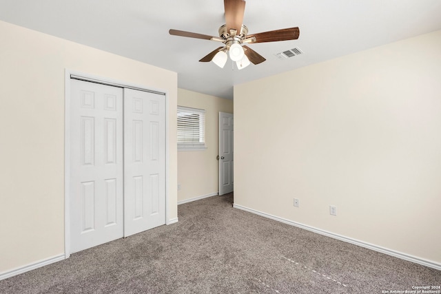 unfurnished bedroom with visible vents, baseboards, carpet, a closet, and a ceiling fan